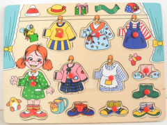Greifpuzzle Mädchen mit Kleidern aus Holz