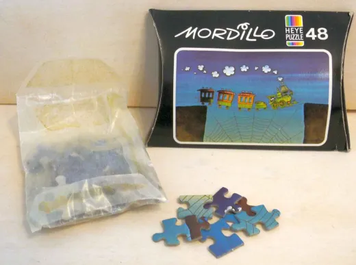 Mini Puzzle Mordillo Zug auf Spinnennetz - 48 Teile